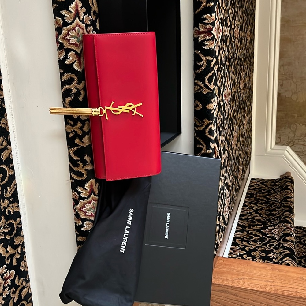 Lightly used YSL red Cluth with gold hardware & tassel